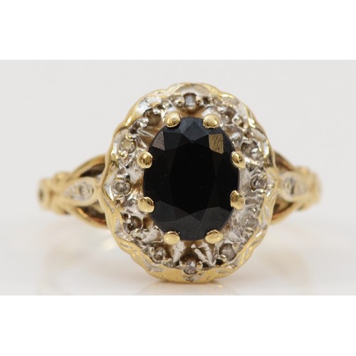 157 - A 9ct gold sapphire and diamond cluster ring with diamond set shoulders, J 1/2, 3.2g