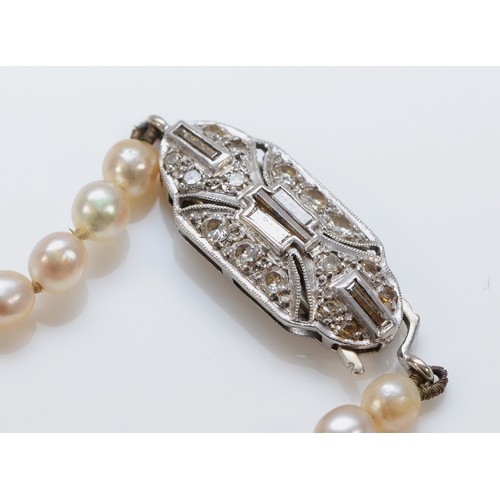 166 - A platinum 850 and diamond clasped pearl necklace, please note necklace string is broken, 19.2g