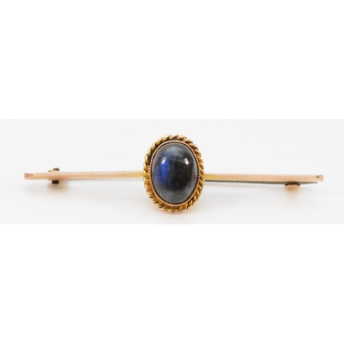 167 - A 9ct gold cabochon cut blue sheen labradorite brooch, 50mm across, 2.3g