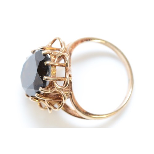 172 - A 9ct gold smokey quartz cocktail ring, L, 4.6g