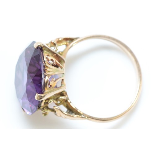 173 - A 14k gold synthetic colour change sapphire cocktail ring, 15mm diameter, N, 6.2g