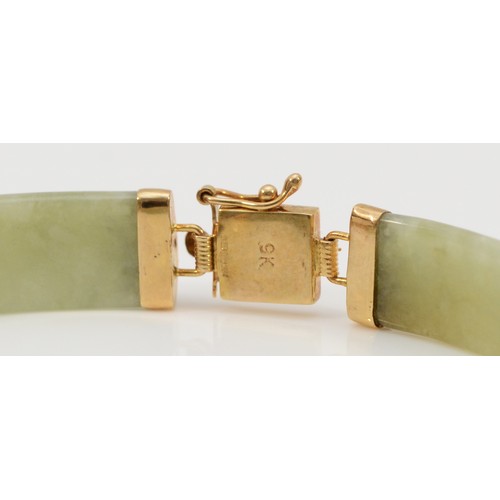 197 - A 9ct gold jade bracelet with Chinese symbols, 11.8g