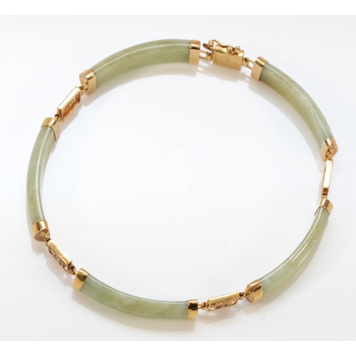 197 - A 9ct gold jade bracelet with Chinese symbols, 11.8g