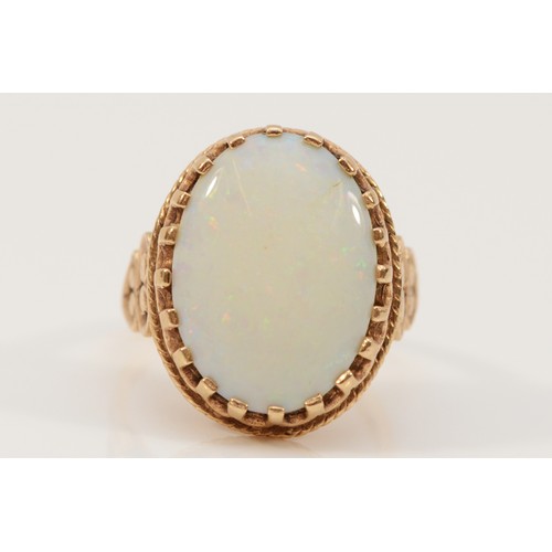 213 - A 9ct gold vintage opal dress ring with patterned mount, N, 5.4g