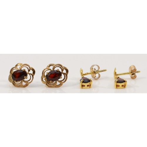 218 - Two pairs of 9ct gold garnet earrings with scroll backs, 2g