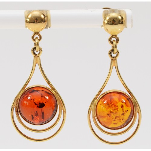 223 - A pair of 9ct gold amber drop earrings with scroll backs, 35mm total length, 3.6g