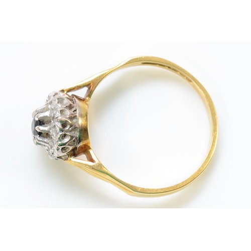 229 - An 18ct gold sapphire and diamond cluster ring, Birmingham 1976, L, 3.1g