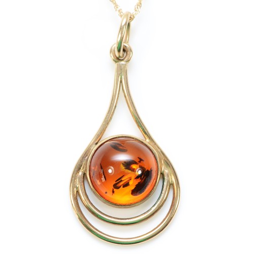 232 - A 9ct gold amber pendant with a chain, 35mm pendant length, 3.6g