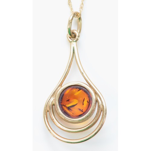 232 - A 9ct gold amber pendant with a chain, 35mm pendant length, 3.6g