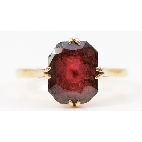 233 - A 9ct gold garnet dress ring, 10mm x 8mm garnet, L 1/2, 1.8g