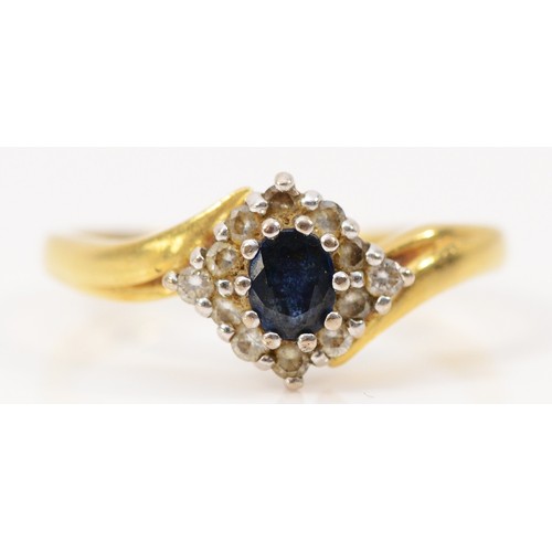 235 - An 18ct gold diamond and sapphire cluster ring, J, 3.1g