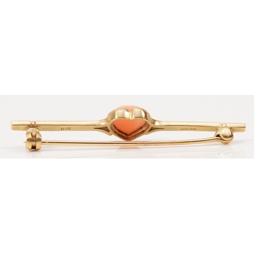 250 - A 9ct gold coral heart bar brooch, London 1990, 50mm across, 2.9g