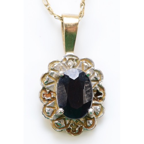 254 - A 9ct gold sapphire pendant with a chain, 1.7g