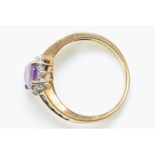 256 - A 9ct gold amethyst and diamond dress ring, amethyst set shoulders, O, 3g