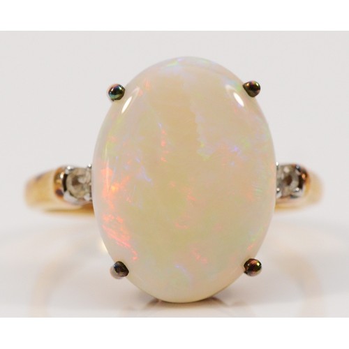 262 - A 9ct gold opal and white gemstone dress ring, 16mm x 12mm opal, N, 3.6g