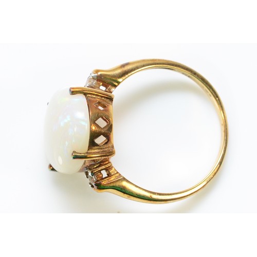 262 - A 9ct gold opal and white gemstone dress ring, 16mm x 12mm opal, N, 3.6g