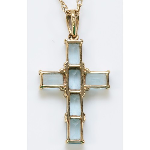 265 - A 9ct gold topaz cross pendant with a chain, 25mm cross length, 3.6g