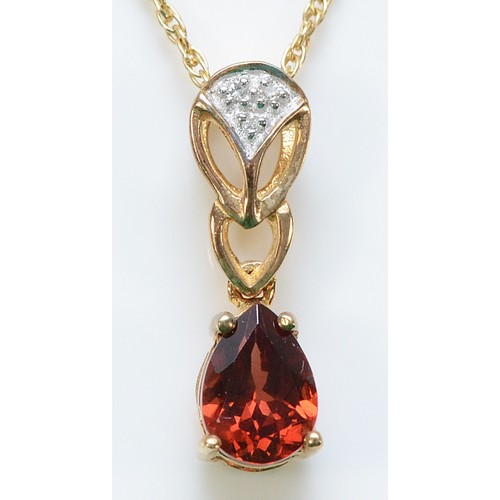 268 - A 9ct gold diamond and garnet pendant with a chain, 17mm drop, 1.9g