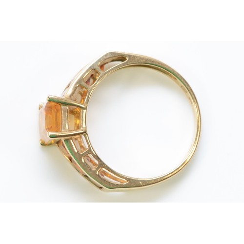 282 - A 9ct gold vari-hue orange gemstone dress ring, M, 2.8g