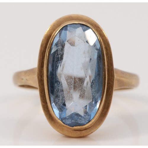 283 - A 9ct gold blue gemstone dress ring, 15mm x 8mm gemstone, P, 4.1g