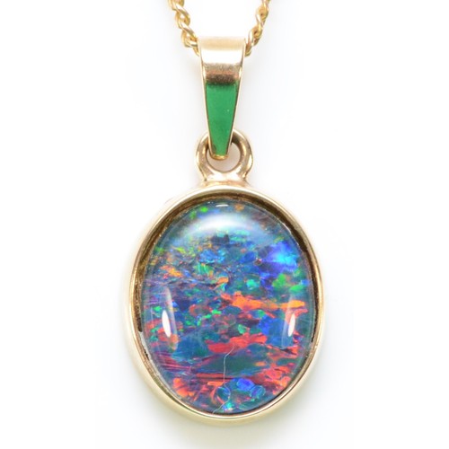 284 - A 9ct gold opal triplet pendant with a chain, 11mm x 9mm opal, 2.5g