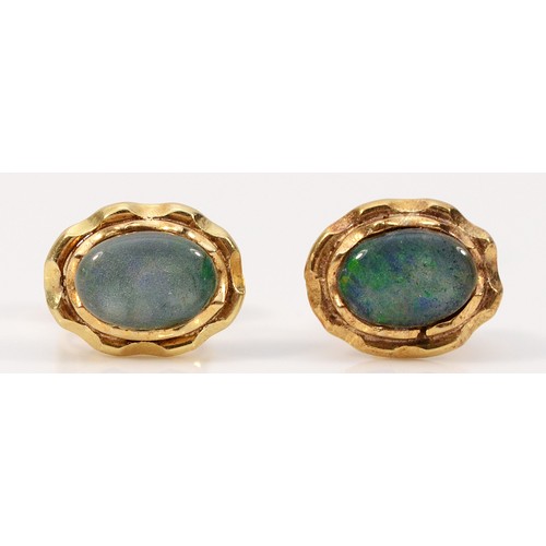 288 - A pair of 14k gold opal doublet earrings with scroll backs, 1.5g