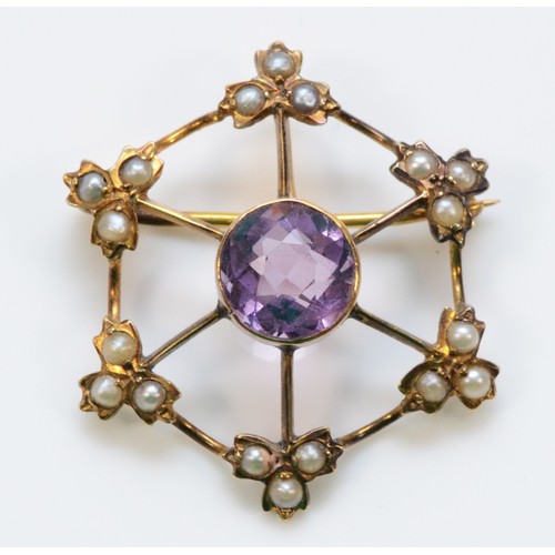 291 - An unmarked 9ct gold amethyst and seed pearl brooch, 7mm amethyst, 25mm total diameter, 2.4g