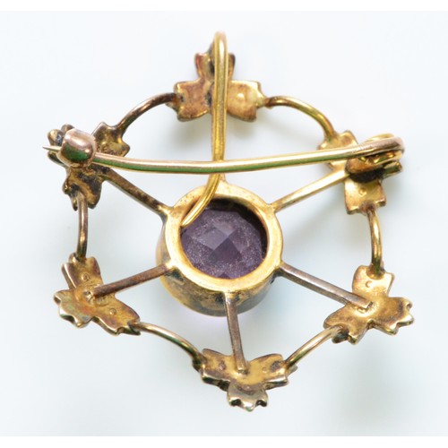 291 - An unmarked 9ct gold amethyst and seed pearl brooch, 7mm amethyst, 25mm total diameter, 2.4g