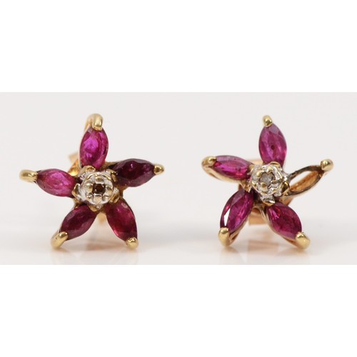 305 - A pair of 9ct gold ruby and diamond floral earrings with scroll backs, one setting vacant, 1.2g