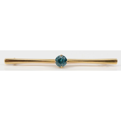 307 - A 9ct gold blue zircon bar brooch, 58mm across, 6mm diameter blue zircon, 3.6g