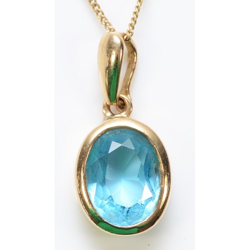 313 - A 9ct gold blue topaz pendant with a chain, 9mm x 6mm topaz, 2.2g