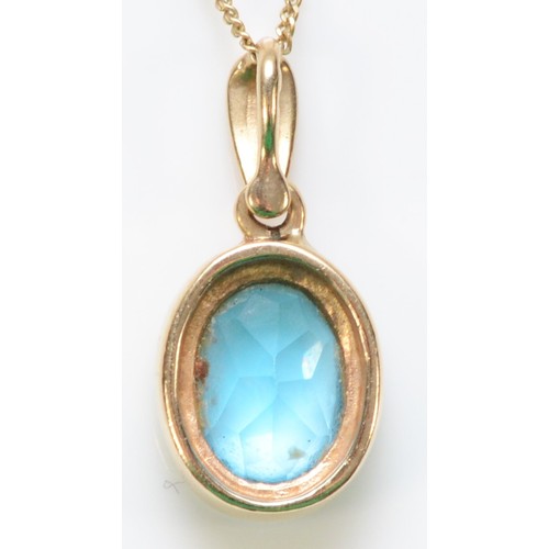 313 - A 9ct gold blue topaz pendant with a chain, 9mm x 6mm topaz, 2.2g