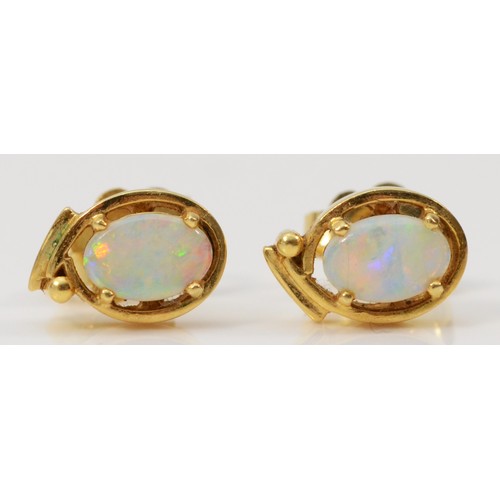 316 - A pair of 18ct gold opal earrings with scroll backs, 2.2g