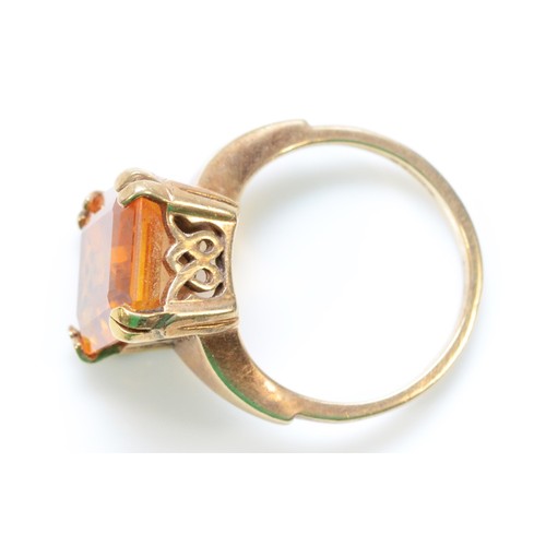 322 - A 9ct gold yellow gemstone dress ring with open work gallery, J 1/2, 5.2g