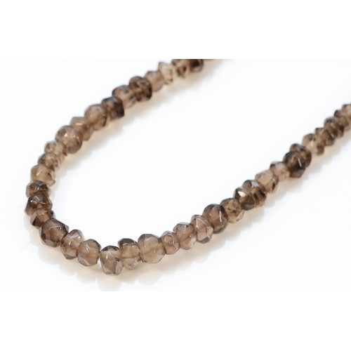 323 - A 9ct gold clasp smokey quartz beaded necklace, 12.3g