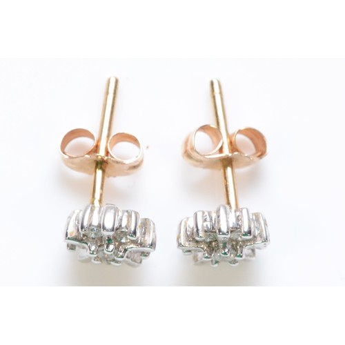 328 - A pair of 9ct gold diamond cluster earrings, 1g