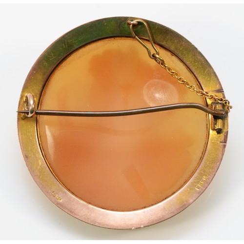 331 - A 9ct gold antique shell cameo brooch, with a safety chain, 40mm total diameter, 9.5g