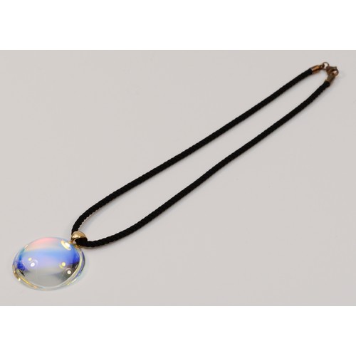 335 - An 18ct gold Baccarat glass pendant with a black cord chain and 9ct gold clasp, 35mm diameter pendan... 