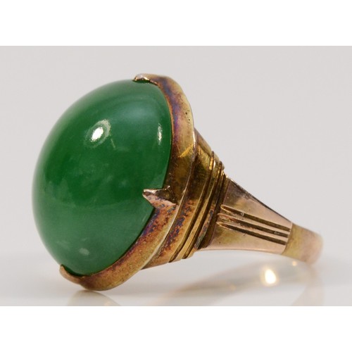 338 - A 14k gold vintage cabochon cut jadeite dress ring, 16mm x 13mm jadeite, J 1/2, 4.6g