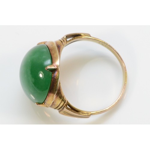 338 - A 14k gold vintage cabochon cut jadeite dress ring, 16mm x 13mm jadeite, J 1/2, 4.6g