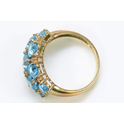 339 - A 9ct gold vari-cut blue gemstone dress ring, Q, 4.4g