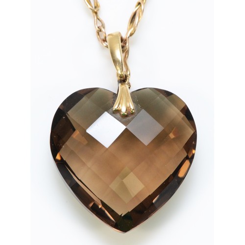 348 - A 9ct gold faceted heart smokey quartz pendant with a 9ct gold chain, 25mm across, 12.1g