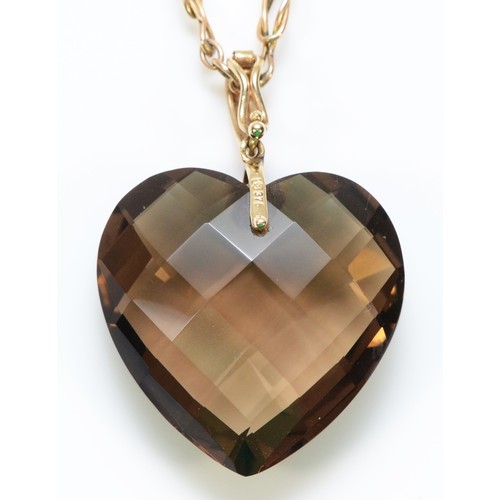 348 - A 9ct gold faceted heart smokey quartz pendant with a 9ct gold chain, 25mm across, 12.1g