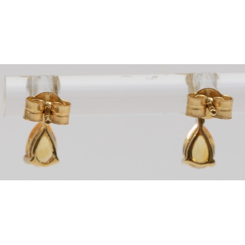 351 - A pair of 9ct gold citrine and diamond earrings with scroll backs, 1g