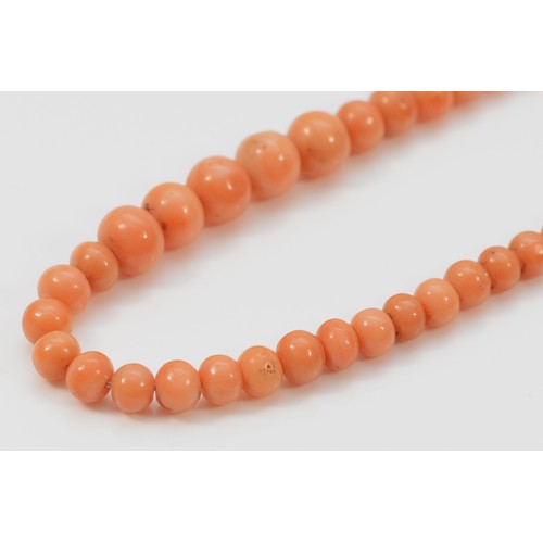 366 - A 9ct gold clasp coral bead necklace, graduating sized beads, 19.5g