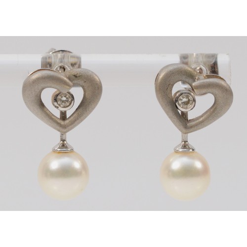 493 - A pair of 18ct white gold cultured pearl and diamond heart shaped earrings with scroll backs, 20mm d... 