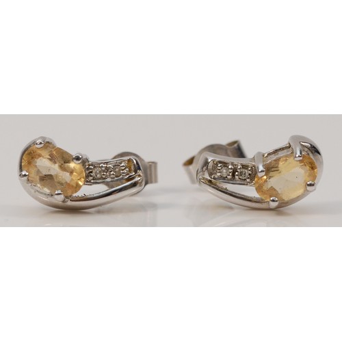 498 - A pair of 9ct white gold citrine and diamond earrings with scroll backs, 12mm drop, 2.3g