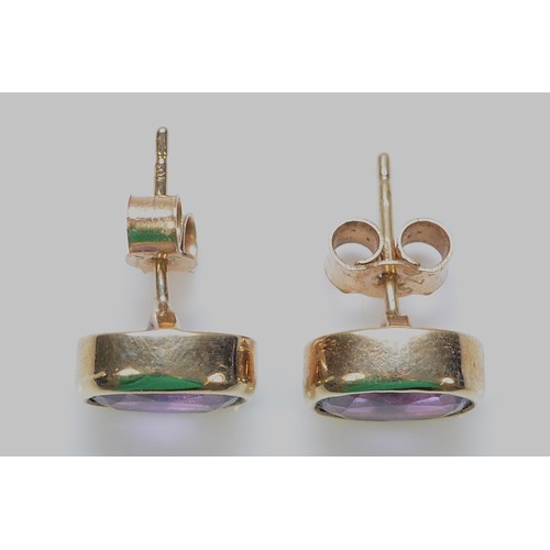 505 - A pair of 9ct gold amethyst earrings with scroll backs, 8mm x 5mm, 2.1g