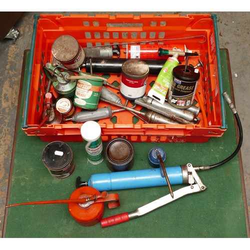 14 - A collection of oil cans, grease guns and grease in cans and tubes.