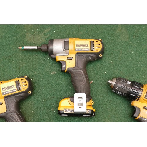 20 - A collection of Dewalt cordless tools, including two impact drivers, two drills, one battery and one... 